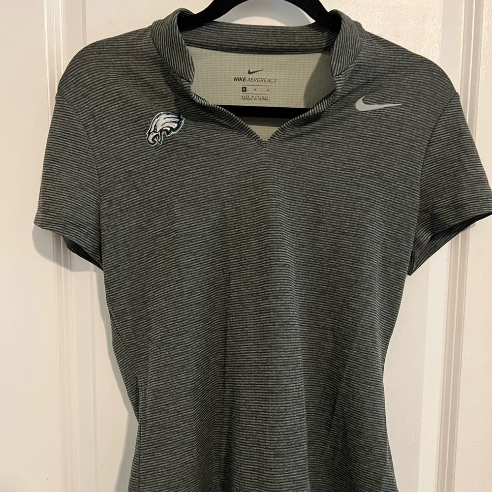 Nike golf polo with eagles logo. NFL licensed